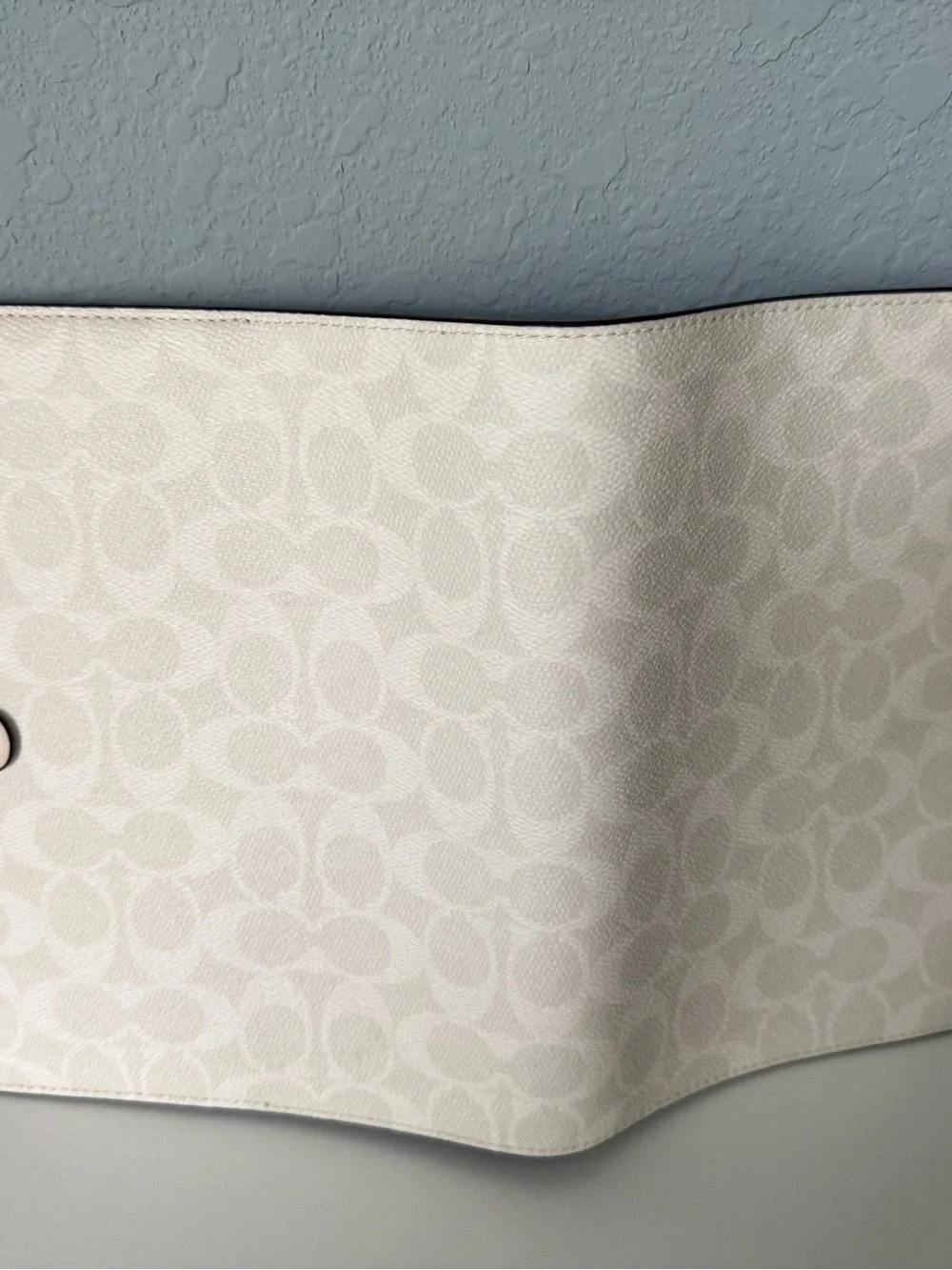 Brand new white coach notebook.